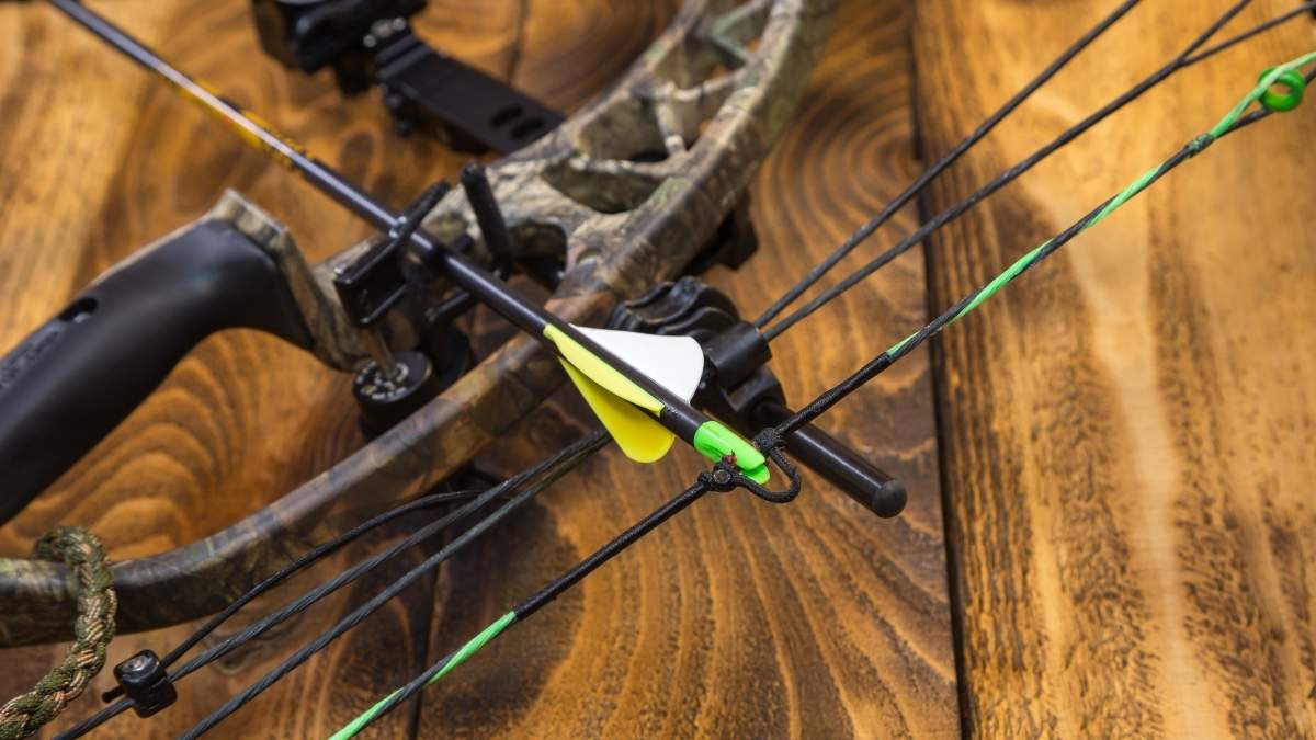 Camouflage compound hunting bow with arrow